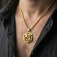 Load image into Gallery viewer, Gold plated Anubis medallion pendant necklace worn on the neck, lifestyle photo featuring warm tone finish and strong statement Egyptian talisman presence.