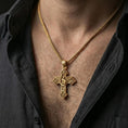 Load image into Gallery viewer, Gold plated Saint Michael necklace with winged protector motif and decorative cross form worn on the neck in a premium lifestyle composition with strong Christian jewelry styling