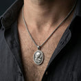 Load image into Gallery viewer, Oxidized Immaculate Heart Virgin Mary pendant worn on the neck in a lifestyle jewelry shot, styled against the chest for a devotional and timeless look