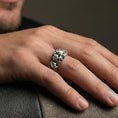 Load image into Gallery viewer, Oxidized skull band ring worn on a finger, lifestyle framing showing realistic scale and bold vintage contrast in a natural hand pose.