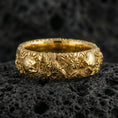 Load image into Gallery viewer, Rose gold plated skull and koi floral band ring on textured volcanic rock, centered studio-style close-up showcasing soft rosy glow and intricate skull-and-koi floral detailing with a refined finish.