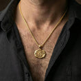 Load image into Gallery viewer, Gold plated third eye chakra necklace with Om symbol and triangular motif worn on the neck in a premium lifestyle composition with elegant spiritual jewelry styling