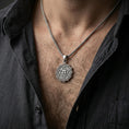 Load image into Gallery viewer, Oxidized Anahata chakra pendant with sacred symbol worn on the neck in a lifestyle jewelry shot, styled against the chest for a bold and spiritual look