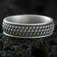 Load image into Gallery viewer, Oxidized sterling silver geometric weave band ring on volcanic stone, macro close-up emphasizing the interlocking lattice texture and dark antique contrast.
Polished silver geometric weave band ring on volcanic stone, crisp product photo highlighting the clean shine and repeating woven pattern detail.