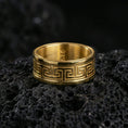 Load image into Gallery viewer, Gold plated Greek key spinner ring on volcanic stone, premium close-up emphasizing warm gold tone along the meander design and refined engraved contrast.