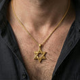 Load image into Gallery viewer, Gold plated Star of David pendant with open hexagram form and ornamental linework worn on the neck in a premium lifestyle composition with timeless spiritual jewelry styling