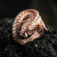Load image into Gallery viewer, Rose gold plated koi fish wrap ring on volcanic stone, elegant macro shot capturing soft rose reflections, detailed scale carving, and dimensional wrap form.
