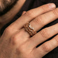 Load image into Gallery viewer, Rose gold plated skull ring worn on the finger, lifestyle image showing elegant rose tone, detailed skull relief, and premium modern edge.
