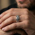Load image into Gallery viewer, Polished silver lizard skin spinner ring worn on the finger, lifestyle shot highlighting modern shine, tactile reptile pattern, and everyday fidget-ready wear.