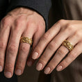 Load image into Gallery viewer, Gold plated guardian lion band ring worn on the finger, lifestyle shot featuring rich golden glow and dramatic lion detailing for a standout men’s style.