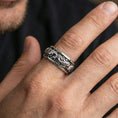 Load image into Gallery viewer, Koi fish sterling silver band ring worn on a finger, polished silver look with smooth reflections highlighting the sculpted koi fish and flowing water design.