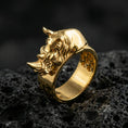 Load image into Gallery viewer, Sterling silver rhino head ring photographed on black volcanic stone, shown in a gold plated finish that emphasizes the rhino head relief and premium shine.