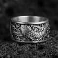 Load image into Gallery viewer, Koi fish spinner band ring on black volcanic stone, shown in an oxidized sterling silver finish with deep contrast around the carved scales.
