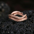 Load image into Gallery viewer, Rose gold plated sterling silver octopus tentacle ring on volcanic stone, sculpted suction cup texture with deep contrast, minimal high-end close-up.