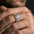 Load image into Gallery viewer, Polished silver engraved geometric band ring on finger, ornate filigree and diamond motif detail, refined everyday wear close-up.