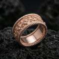 Load image into Gallery viewer, Rose gold plated sterling silver rope border ring on volcanic stone, intricate floral and filigree engraving with deep contrast, minimal high-end close-up.