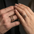 Load image into Gallery viewer, Rose gold plated machinist railway band ring worn on finger, rugged rail texture with rivet accents, elegant lifestyle wear shot.