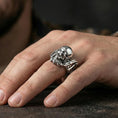 Load image into Gallery viewer, Polished silver gothic biker skull statement ring on finger, crisp skull relief and mechanical frame detail, refined everyday wear close-up.