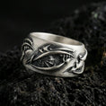 Load image into Gallery viewer, Oxidized sterling silver roots band ring on dark volcanic rock, organic vine and bark texture engraving, premium macro product shot.