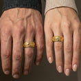 Load image into Gallery viewer, Gold plated koi fish spinner band worn on finger, detailed koi and wave engraving on rotating band, premium lifestyle jewelry photo.