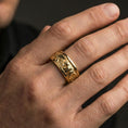 Load image into Gallery viewer, Gold plated bear scene band worn on finger, detailed bear engraving with rugged nature texture, premium lifestyle jewelry photo.