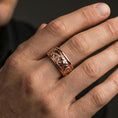 Load image into Gallery viewer, Rose gold plated bear relief band ring worn on finger, sculpted bear scene detail with ornate side accents, elegant lifestyle wear shot.