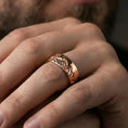 Load image into Gallery viewer, Rose gold plated mountain skyline band ring worn on finger, engraved Grand Teton peaks with rugged detail, elegant lifestyle wear shot.