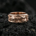 Load image into Gallery viewer, Rose gold plated sterling silver Moses spinner ring on volcanic stone, sculpted Renaissance portrait relief with deep contrast, minimal high-end close-up.