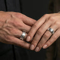 Load image into Gallery viewer, Polished silver wave filigree fidget spinner ring on finger, crisp swirl relief and smooth edges, refined everyday wear close-up.
