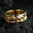 Load image into Gallery viewer, Gold plated Michelangelo Moses spinner band ring on volcanic rock, detailed portrait relief on rotating band with vintage scroll accents, luxury jewelry product photography.
