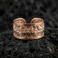 Load image into Gallery viewer, Rose gold plated sterling silver Last Supper band on volcanic stone, sculpted apostle scene relief with deep contrast and clean borders, minimal high-end close-up.