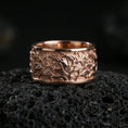 Load image into Gallery viewer, Rose gold plated sterling silver flame swirl band on volcanic stone, sculpted fire relief with strong contrast and clean borders, minimal high-end close-up.