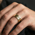 Load image into Gallery viewer, Gold plated Tree of Life ring worn on finger, rich warm tone emphasizing the tree-and-horizon engraving, lifestyle jewelry shot.