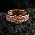 Load image into Gallery viewer, Rose gold plated Yin Yang koi fish ring on volcanic rock, soft warm highlights enhancing the flowing fish-and-lotus motif, luxury product shot.