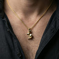 Load image into Gallery viewer, Gold plated origami rabbit pendant with angular minimalist design worn on the neck in a premium lifestyle composition with refined contemporary jewelry styling
