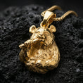 Load image into Gallery viewer, Gold plated panda pendant with detailed animal expression, textured fur surface, and charming bamboo motif showcased on black volcanic rock in a refined macro jewelry image