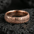 Load image into Gallery viewer, Rose gold plated snake scale band ring on volcanic rock, soft warm tone highlighting the reptile skin pattern and sculpted edges.