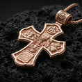 Load image into Gallery viewer, Holy Trinity cross pendant on volcanic stone in a rose gold plated look, bringing warmth to the engraved sacred motifs.
