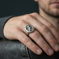 Load image into Gallery viewer, A 925 sterling silver cat signet ring worn on the finger, oxidized look emphasizing the gothic animal relief.