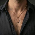 Load image into Gallery viewer, A rose gold plated Saint John the Evangelist medallion worn on the neck, elegant saint medal necklace for faith-based styling.