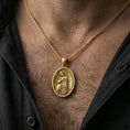 Load image into Gallery viewer, Gold plated angel medallion pendant worn on the neck in a premium lifestyle composition with elegant spiritual jewelry styling