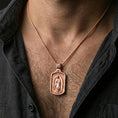 Load image into Gallery viewer, Rose gold plated Guadalupe religious pendant worn on the neck in a refined lifestyle shot with a warm and elegant presentation