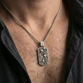 Load image into Gallery viewer, Oxidized sea life pendant with fish tank scene worn on the neck in a lifestyle jewelry shot, styled against the chest for a playful and ocean-inspired statement look