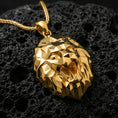 Load image into Gallery viewer, Gold plated polygonal lion pendant with sculpted faceted lion head, geometric angular detailing, and striking spirit animal silhouette showcased on black volcanic rock in a refined macro jewelry image