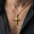 Load image into Gallery viewer, Gold plated gothic skull pendant worn on the neck in a premium lifestyle composition with strong alternative jewelry styling