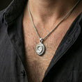 Load image into Gallery viewer, Polished silver crocodile pendant necklace worn on the neck, captured in a close lifestyle shot against the chest for a refined everyday look.