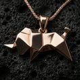 Load image into Gallery viewer, Rose gold plated origami elephant pendant necklace on dark volcanic rock, photographed in a detailed premium studio macro view.