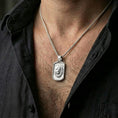 Load image into Gallery viewer, Polished silver bear pendant necklace worn on the neck, shown against the chest in a clean and elegant everyday wear composition.