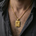 Load image into Gallery viewer, Gold plated cobra pendant necklace worn on the neck, captured on a human model in a premium dark-toned lifestyle frame.