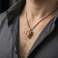 Load image into Gallery viewer, Rose gold plated ram head pendant necklace worn on the neck, presented in a close-up lifestyle shot with a refined masculine aesthetic.